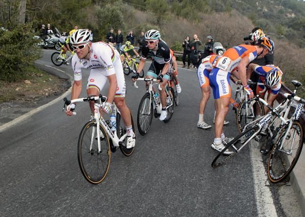 World champion Thor Hushovd (Garmin - Cervelo) passes by Oscar Freire and his Rabobank teammates.