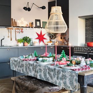 Kitchen decorated with dining table with Christmas tablescape and decorations