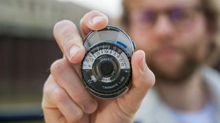 Man holding Sekonic Twinmate L-208 light meter