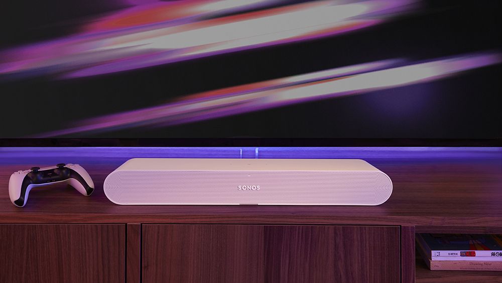 The Sonos Ray one in white on a TV stand 