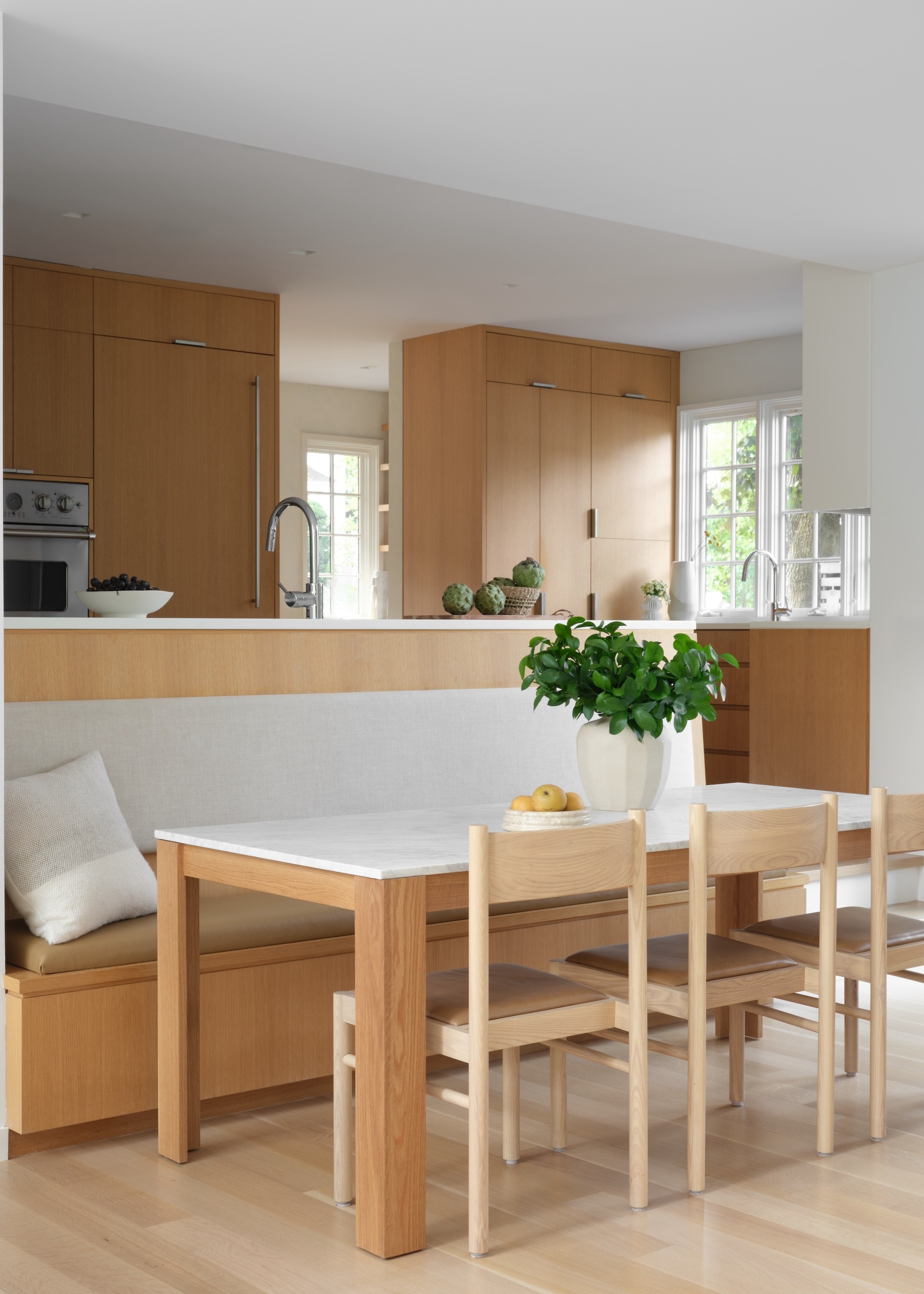 Banquette seating on the back of a kitchen island