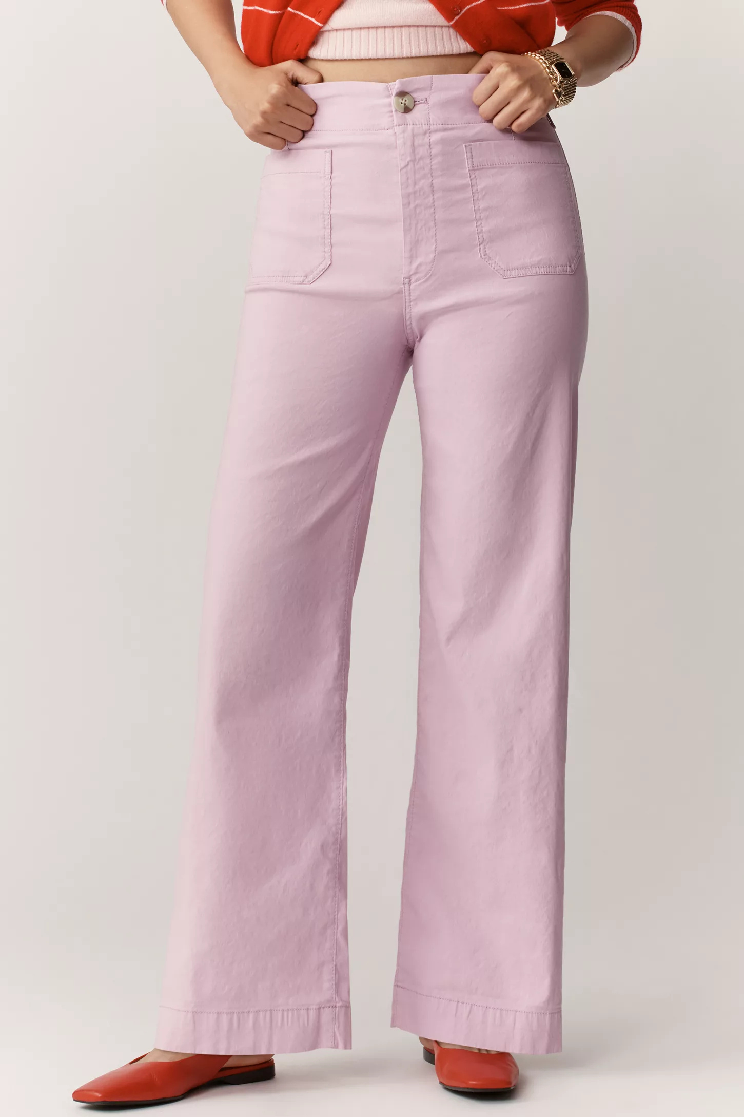 A model wearing lilac Anthropologie jeans