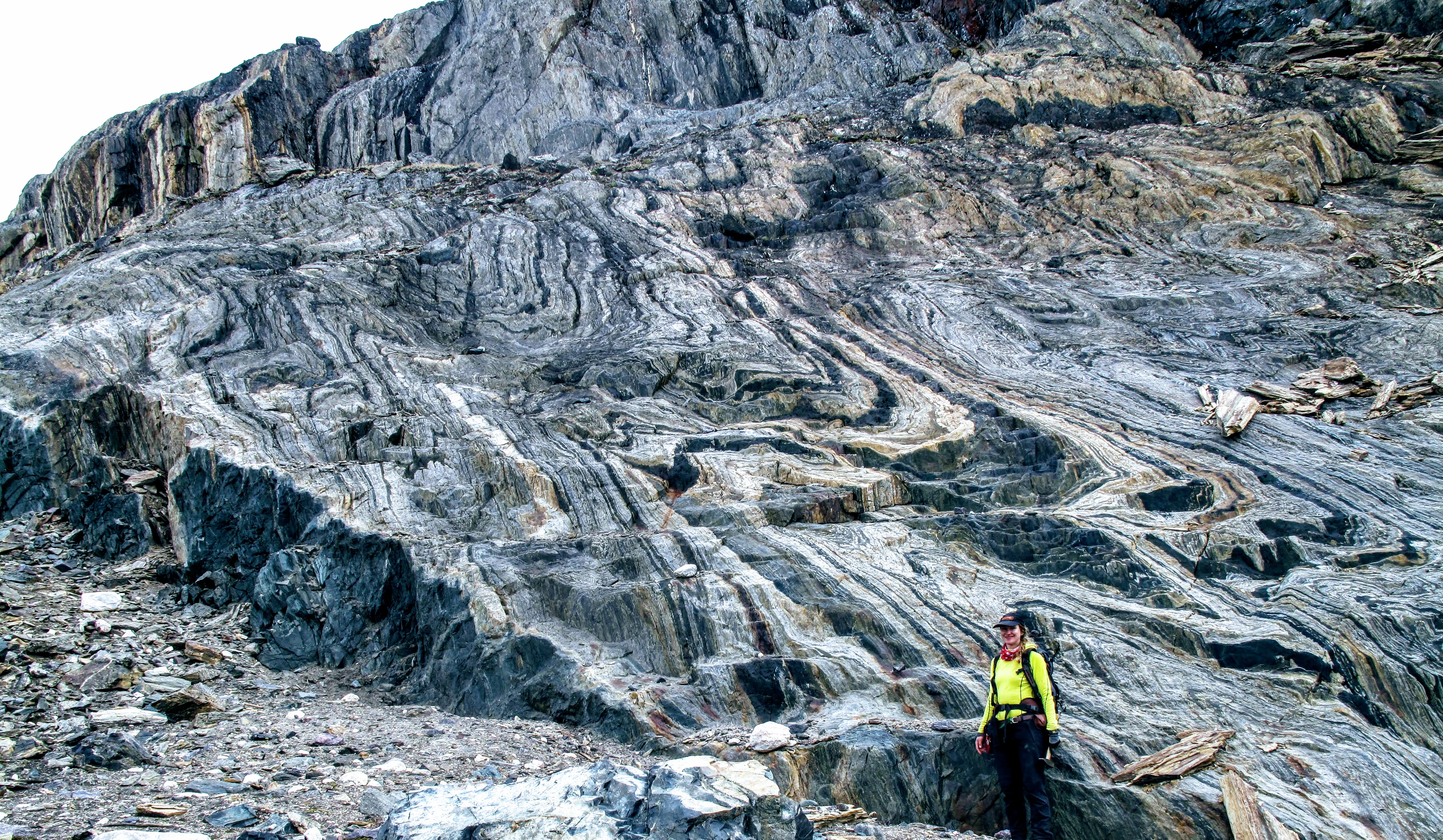 Co-author Athena Eyster standing in front of a large exposure of banded iron formation, the iron rich deposit from which ancient magnetic field signals were extracted.