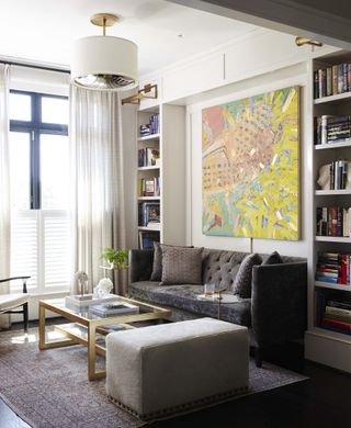 living room with gold coffee table and grey sofa