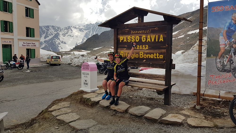Annemiek van Vleuten and Amanda Spratt at the top of a snowy Passo Gavia