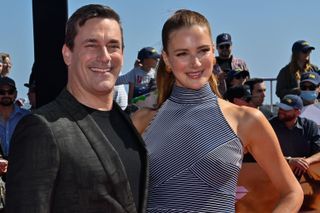 Jon Hamm and Anna Osceola attend the premiere of the motion picture drama "Top Gun: Maverick" at the USS Midway in San Diego, California