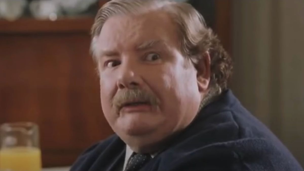 Richard Griffiths sits impatiently at the breakfast table in Harry Potter and the Sorcerer&#039;s Stone.