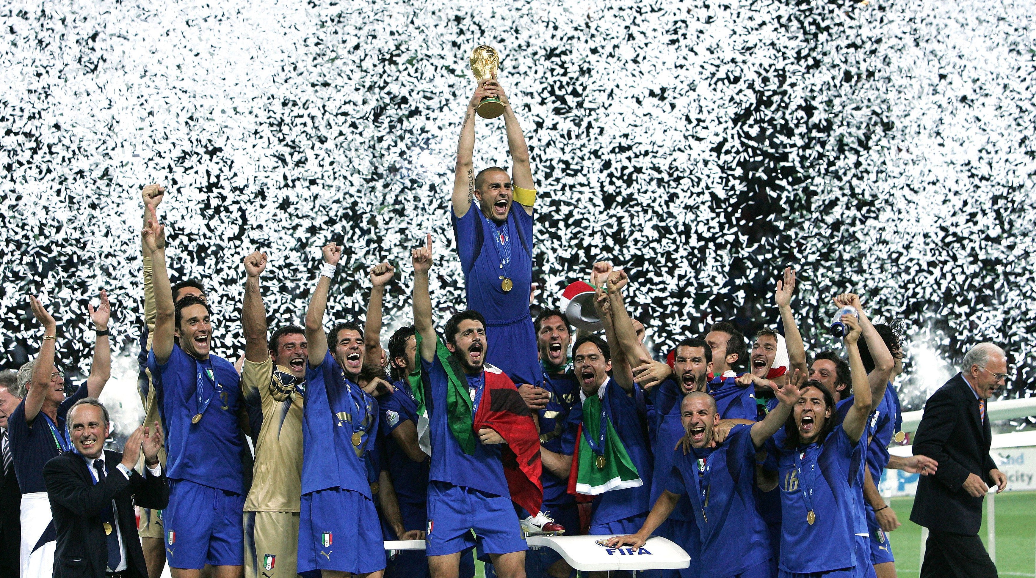 Fabio Cannavaro of Italy and his teammates celebrate with the trophy at the end the World Cup 2006 final football game Italy and France, 09 July 2006 at Berlin stadium. Italy won the 2006 football World Cup by defeating France on penalties. (Photo by Alessandro Sabattini/Getty Images)