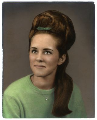 A woman with a beehive hairstyle.