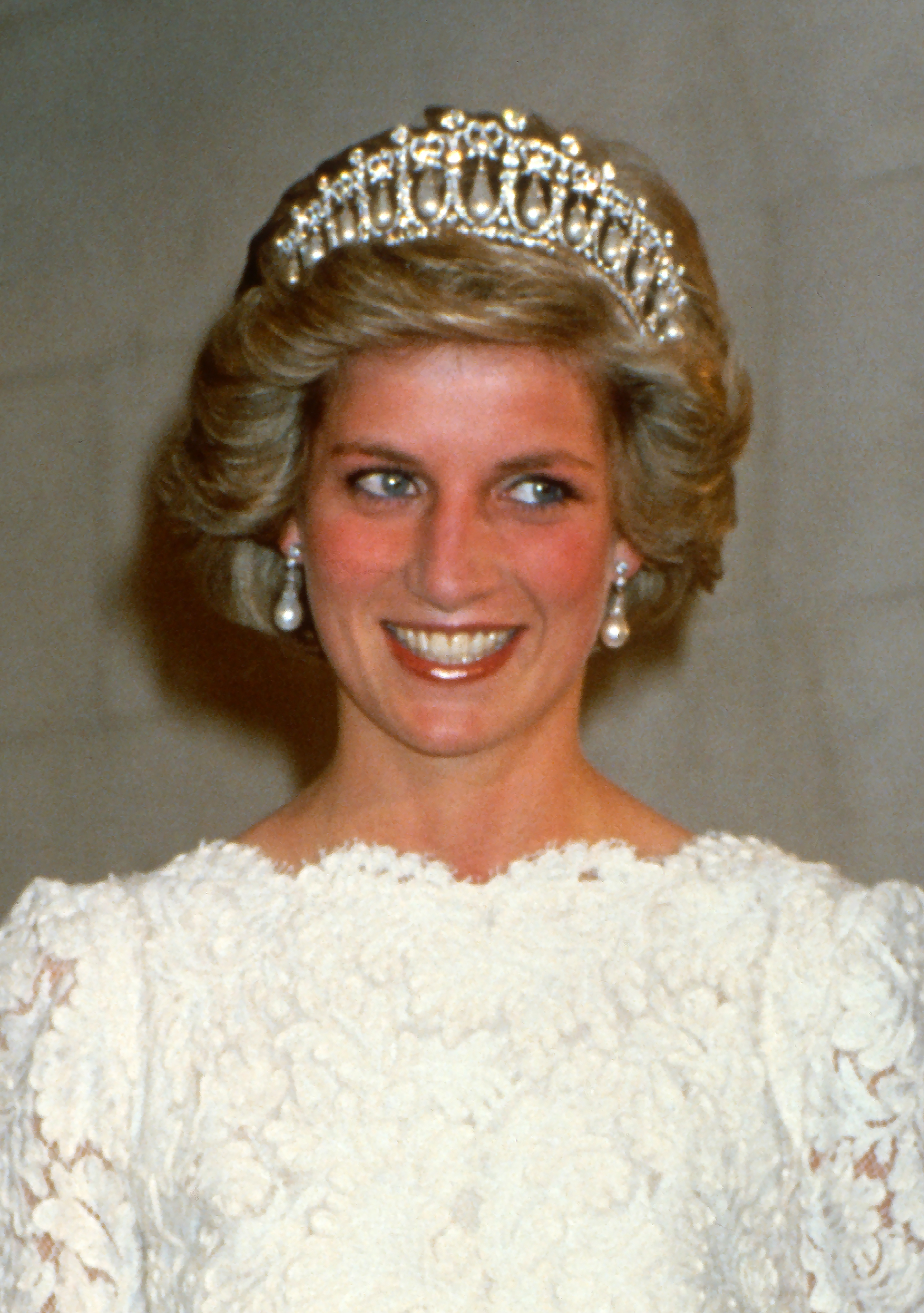 Diana, Princess of Wales, wearing a cream lace gown.