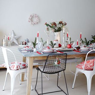 christmas dinning table with white wall and chair
