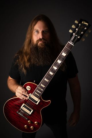 Lamb of God guitarist Mark Morton poses with a Gibson Les Paul