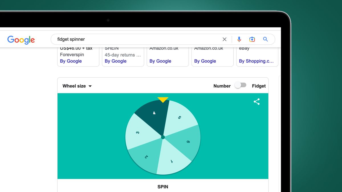 A laptop on a green background showing the fidget spinner Google Easter egg