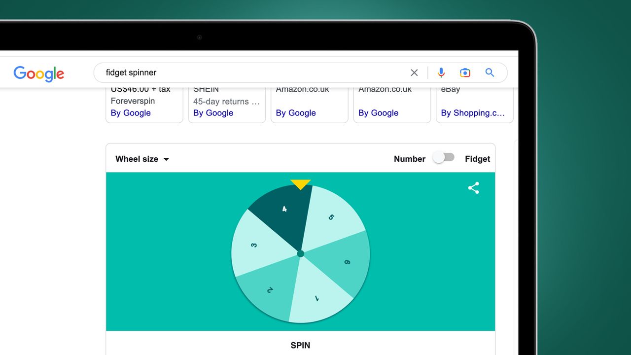 A laptop on a green background showing the fidget spinner Google Easter egg