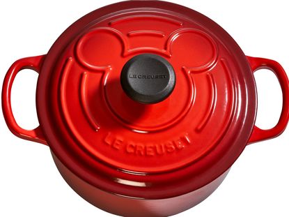 french cookware brand featuring mickey trademark black and red palette
