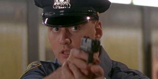 Police officer drawing his gun in Die Hard With A Vengeance