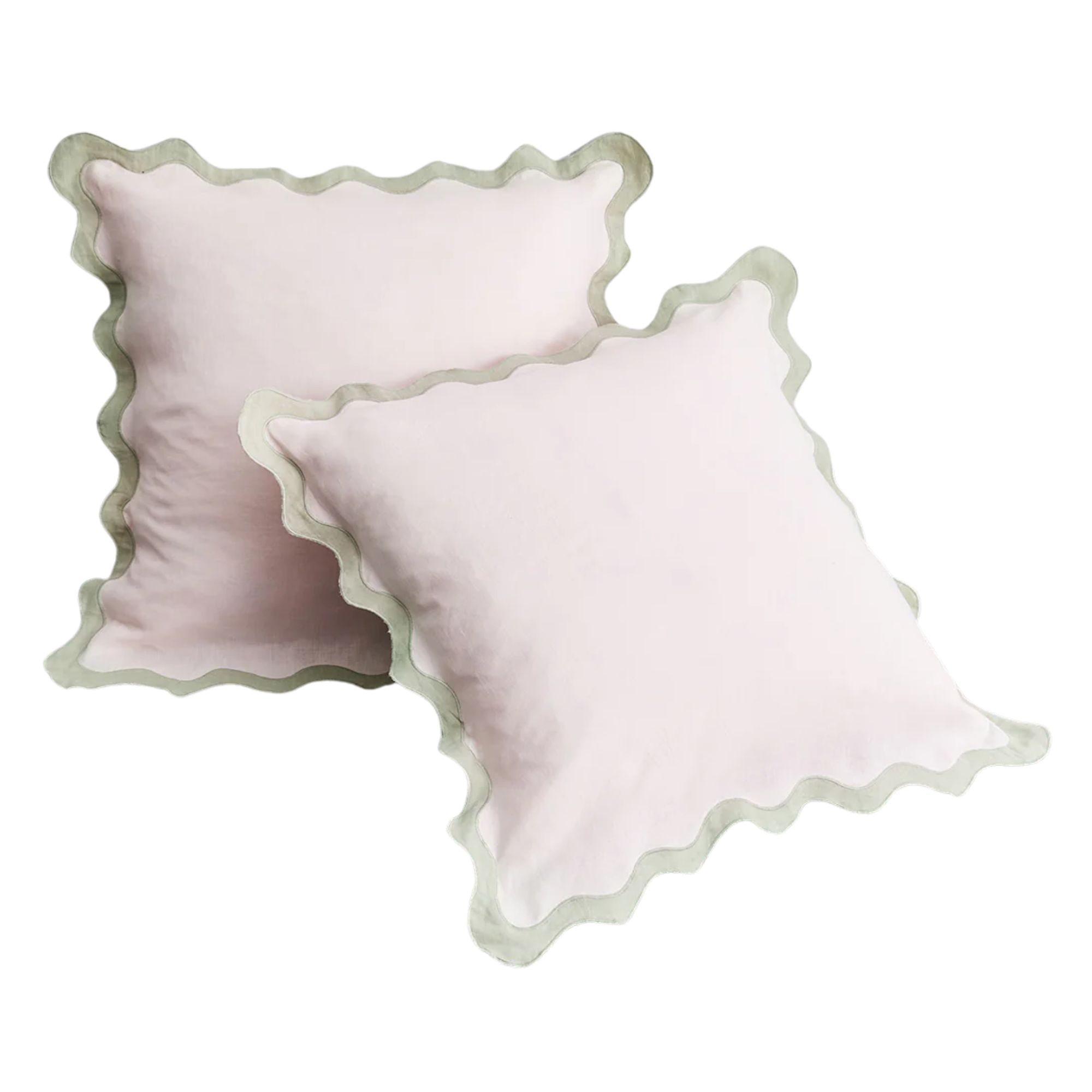 Pale pink pillowcases with pale sage green scalloped edges
