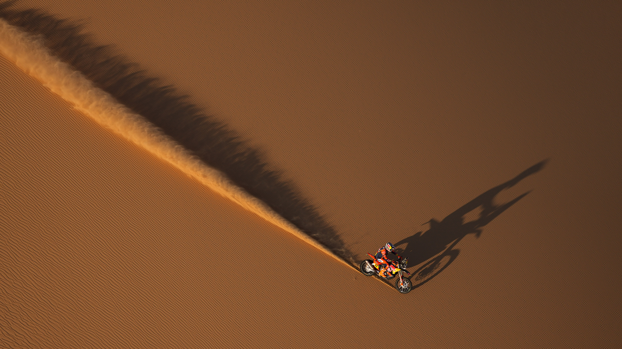 Rider Luciano Benavides crosses a dune during the ninth stage of the Dakar Rally near Bisha, Saudi Arabia