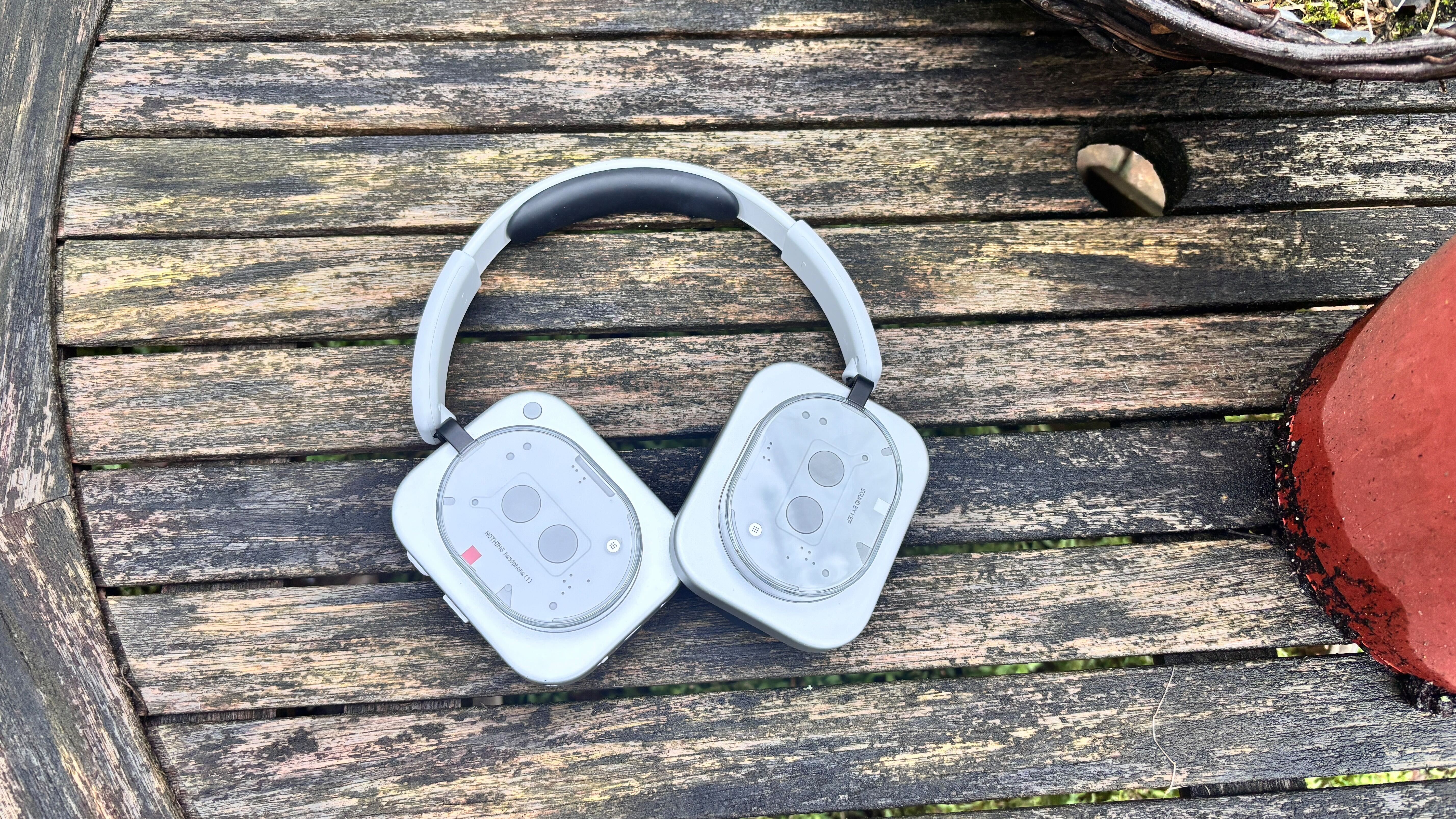 Nothing Headphone (1) over-ears on garden table outside
