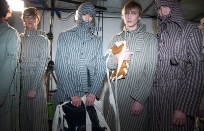 Group of models stood in striped outfits