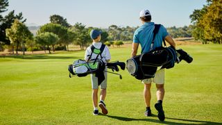 Man and younger boy on golf course