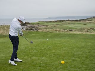 Ben Emerson hitting a driver in windy conditions at Turnberry