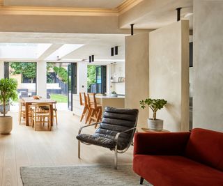 interior shot of living room and kitchen diner with recessed lighting hidden in ceiling