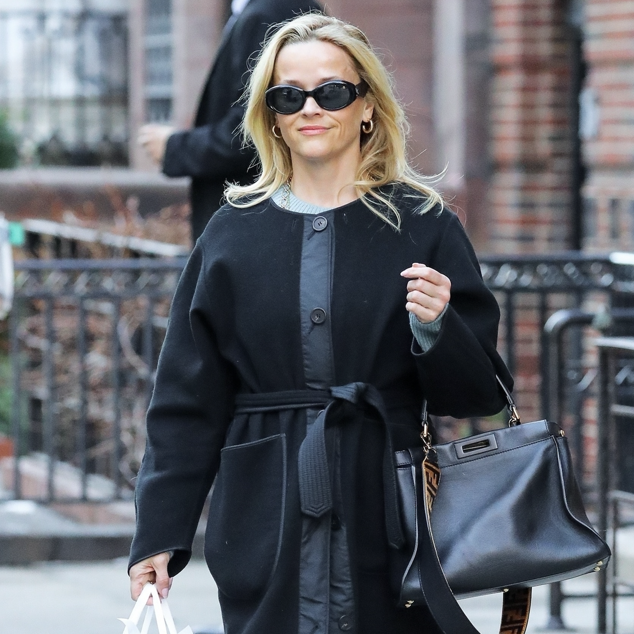 Actress Reese Witherspoon carries her FENDI handbag while shopping for skincare products at Vicki Morav in NYC. on Jan. 24, 2025