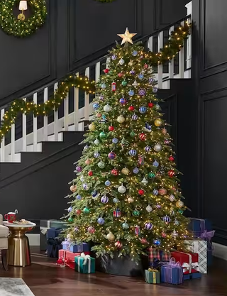 Nicely decorated Christmas tree in a warm living room