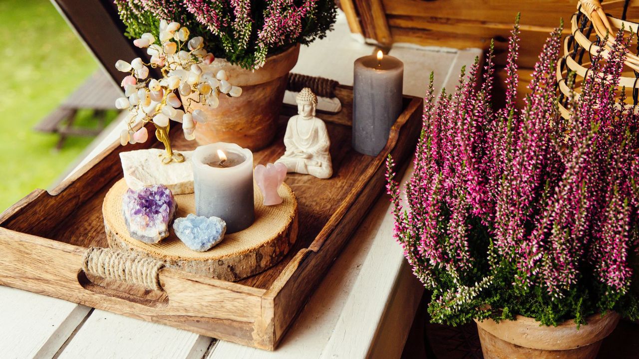 Amethyst arranged on a tray with candles and lavender