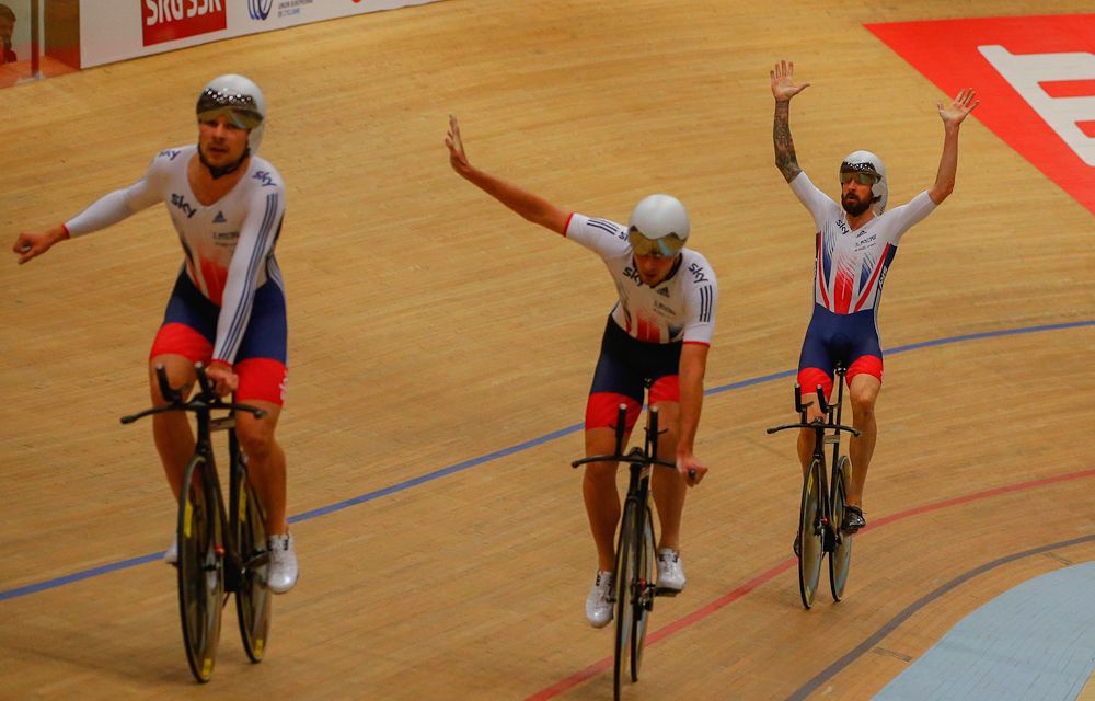 The final three riders for Great Britain celebrate after the finish of the team pursuit final