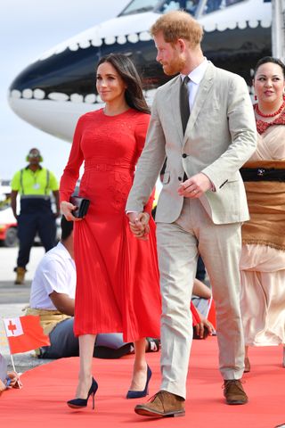 Prince Harry, Duke of Sussex and Meghan, Duchess of Sussex arrive at Nuku'alofa airport on October 25, 2018 in Nuku'alofa, Tonga