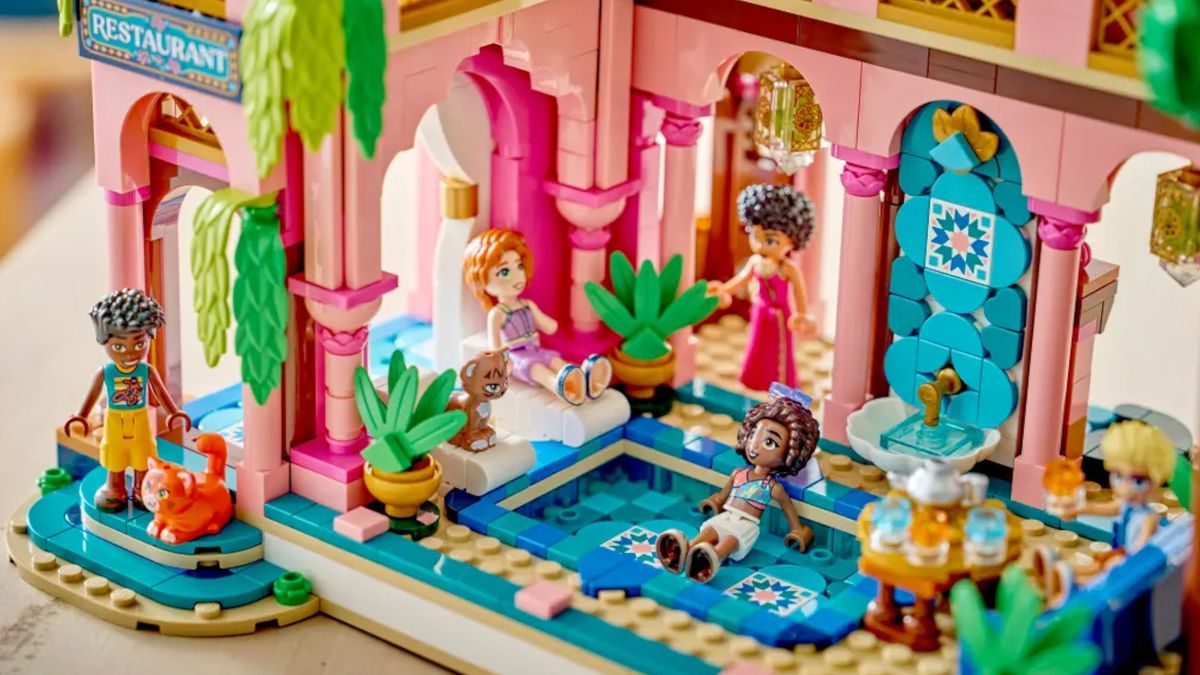 Lego figures lying in a pink restaurant set