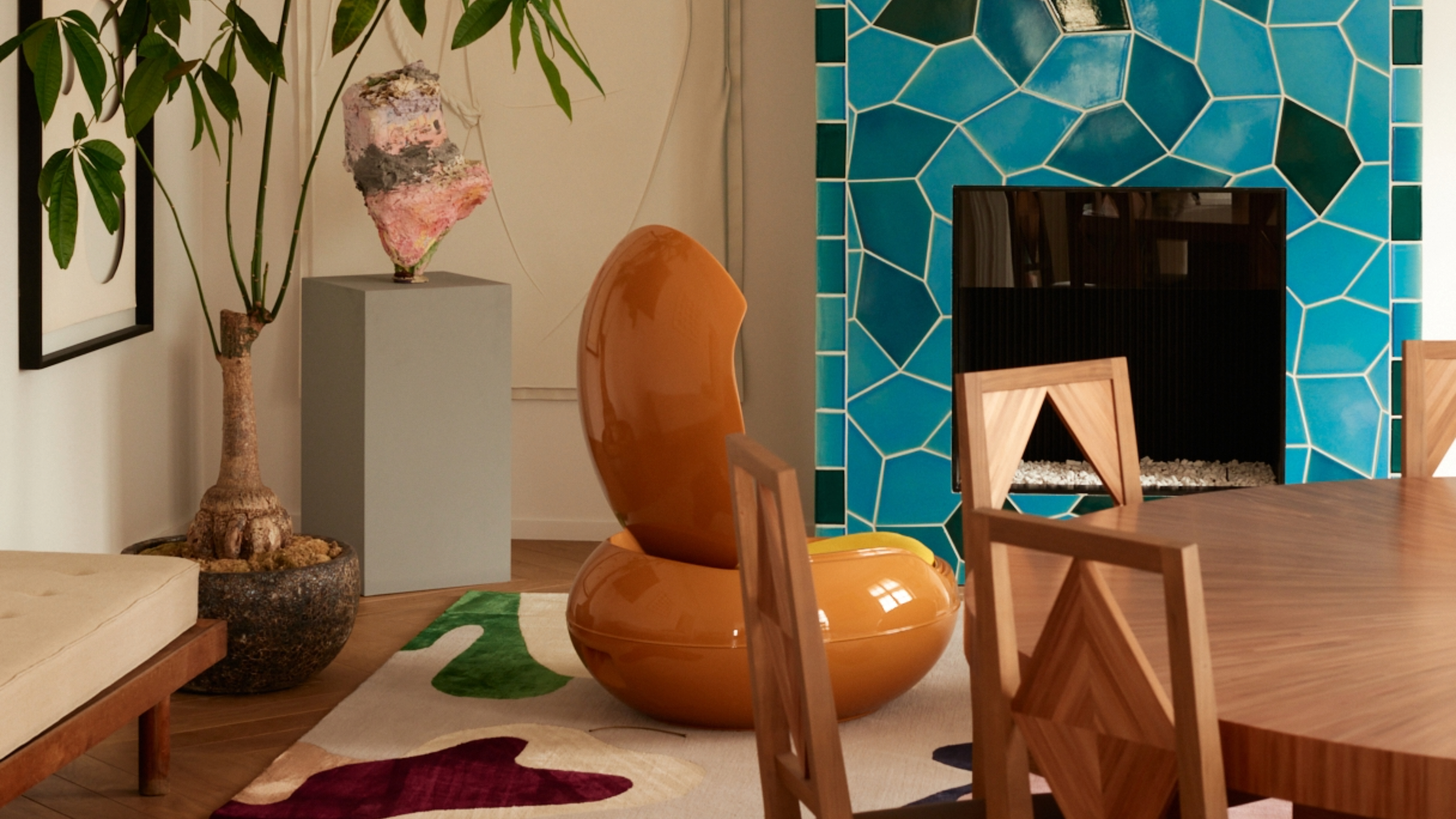 Neotenic living room with abstract rug, colorful tiled fireplace and sculptural chair