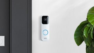 Blink Video Doorbell mounted to white outside wall