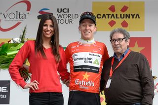 Cameron Meyer in red on the stage 1 podium at Volta a Catalunya.