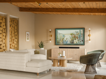A living room with beige walls and an olive green chair