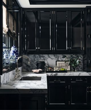 Black cabinets and drawers, marble countertop