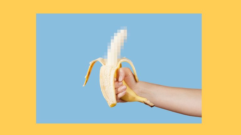 Hidden censored banana in hand on a blue background. Horny (aroused) penis, male erection, prosthetic penis and sexual education. Funny pornography.