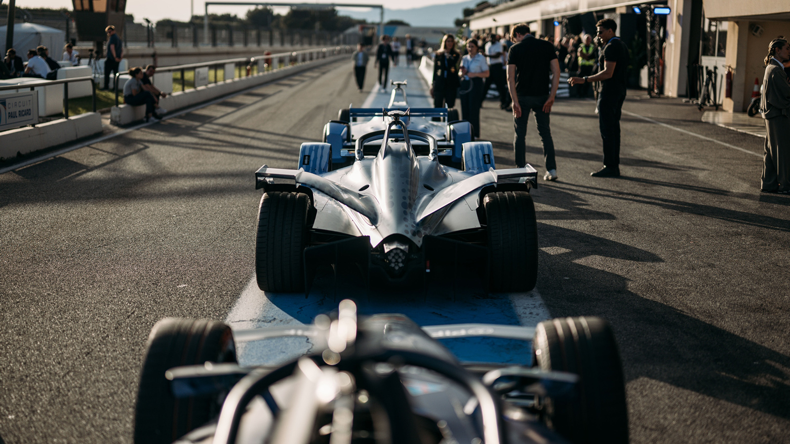 Formula E GEN4 cars lined up in the pit stop