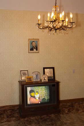 Old box TV with lady holding daughter