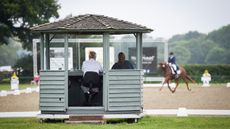 Dressage judges sitting in their hut at C