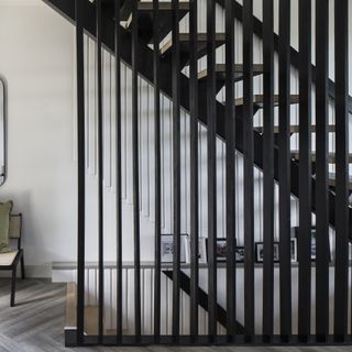 Black open staircase with slats