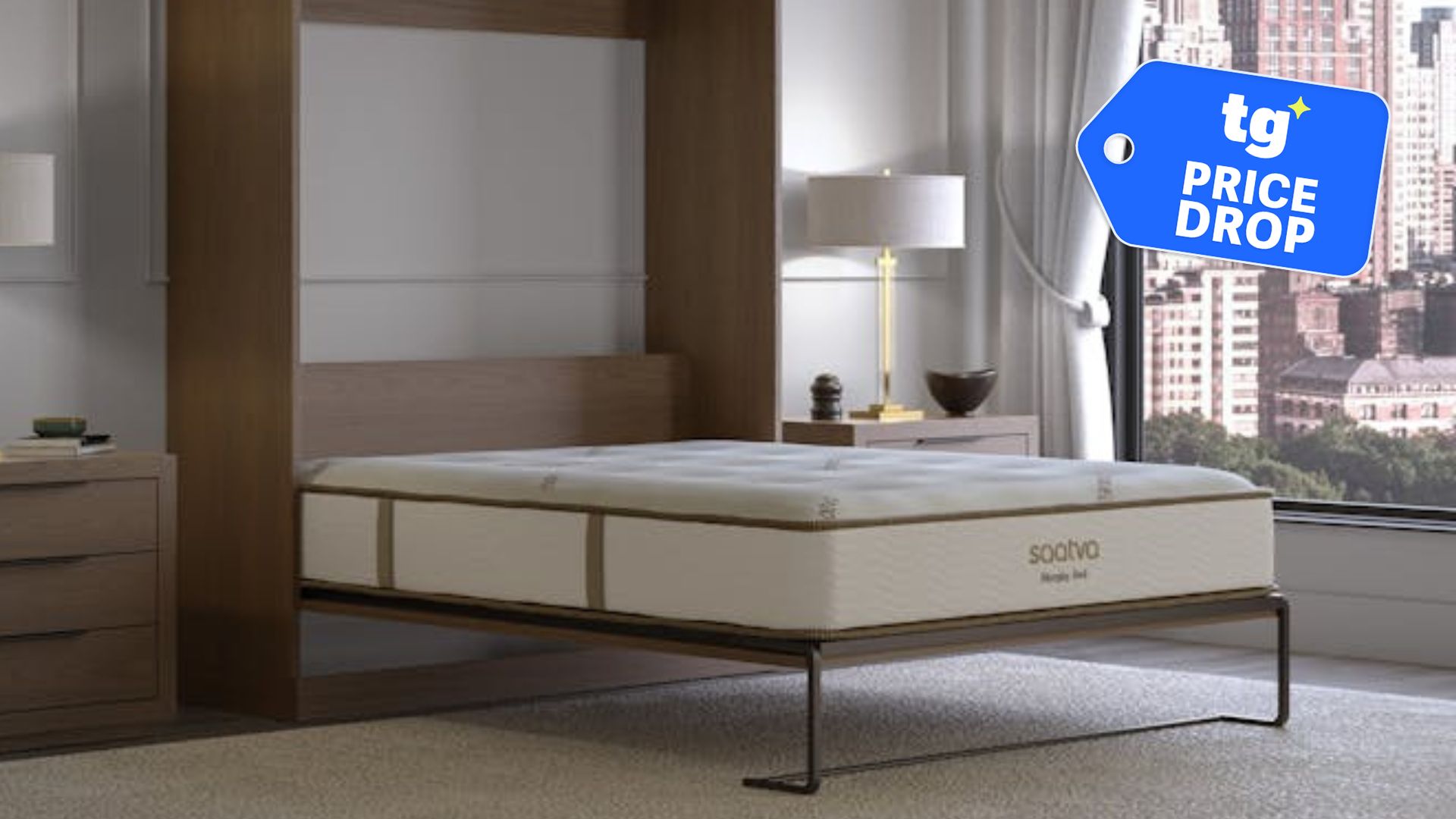 The Saatva Murphy Bed in a luxury apartment setting overlooking a city. In the top right foreground, there is a deals badge.