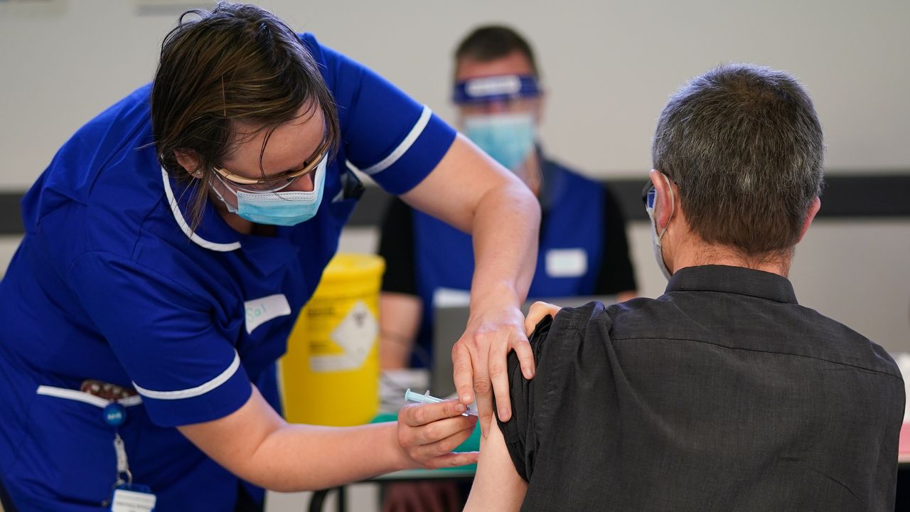 A patient receives a Covid-19 vaccination