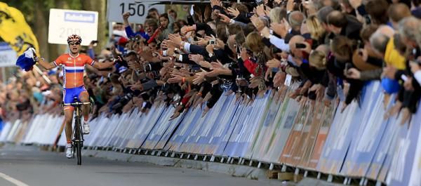 Marianne Vos is greeted by a wall of sound as she nears the finish line.