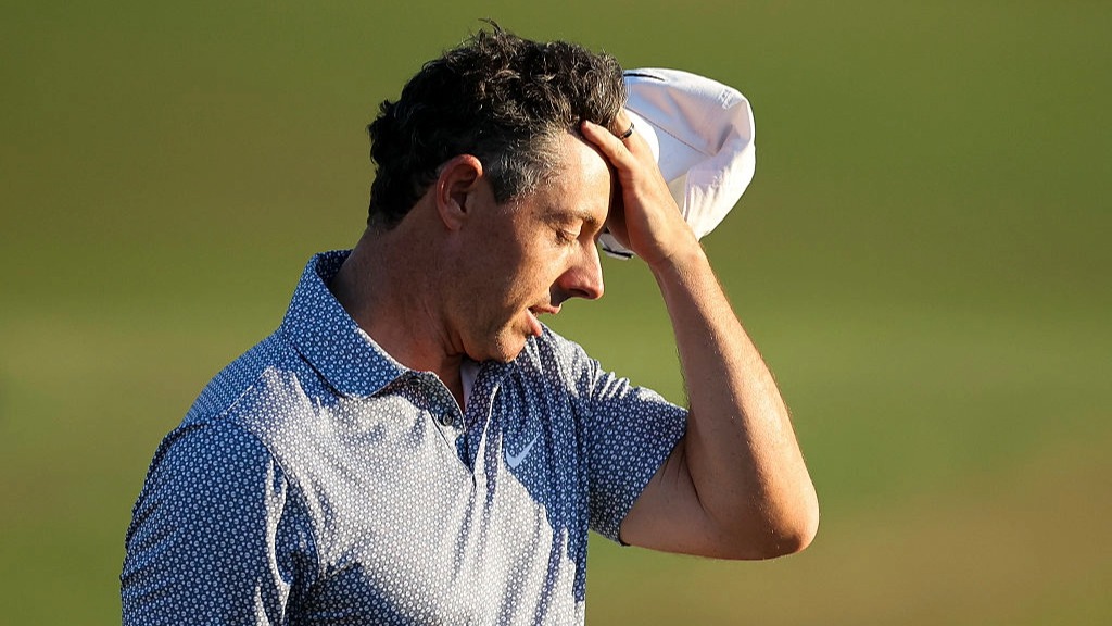 Rory McIlroy scratches his head in dismay after a difficult Round 3 at the Masters 2026.
