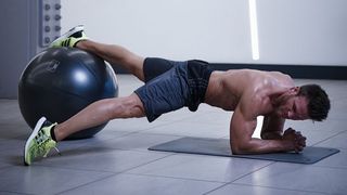 Gym ball decline plank with toe taps