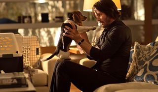 John Wick Keanu Reeves with puppy