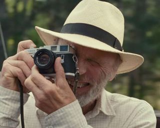 Ed Harris holding a camera